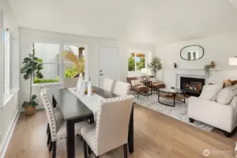 Formal living and dining rooms, looking toward the front entry. Note the beautifully refinished hardwood flooring