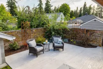 A charming brick wall encloses the patio in the back yard.  Honeycrisp apple tree in the back corner with lots of great apples!