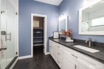 Primary ensuite bath and walk-in-closet.  Double vanity with leathered granite countertop and backsplash, lots of storage (soft close doors and drawers).  Step-in tiled shower with glass enclosure.  WIC has lots of shelving and even room for your dresser in the closet!