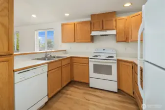 Lots of storage in the kitchen and a well laid of floor plan with an eat at bar