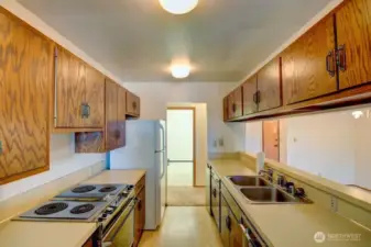 Kitchen looking towards hallway and across to the utility room.