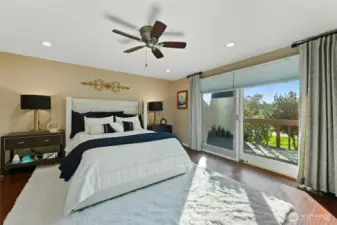 Primary bedroom w/door out to private deck on the right