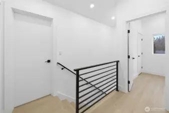 Upstairs, all bedrooms feature vaulted ceilings.