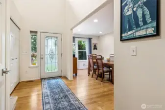 Front entry, hardwood floors, high ceilings, opens to formal dining room