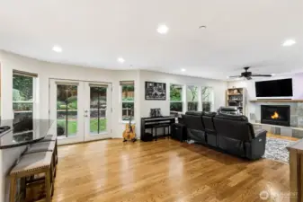 Living room with Wall of windows and french doors leading to the backyard