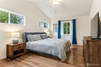 Upstairs primary suite has vaulted ceilings, abundant windows, beautiful territorial views, separate his/hers walk-in closets with built in organizers, hardwood flooring and attached bath with separate shower and tub