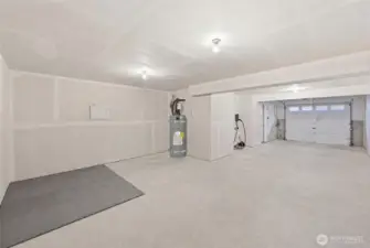 Huge tandem garage with EV plug & space for storage, exercise or workbench.