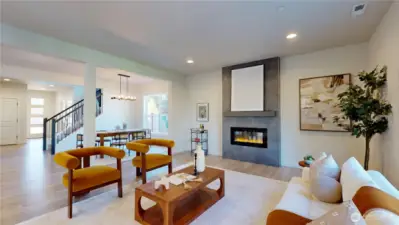 Open the front door pass by the stairs, formal dining area, and into the living room.