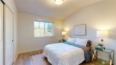 Upstairs - Bedroom 2. Vaulted ceiling and river view. All bedrooms equipped with blackout shades.