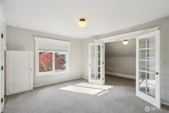 West facing bedroom with additional space - what you see beyond French doors is NOT the closet but could be if you wanted.