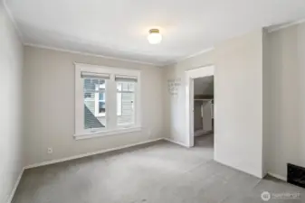 north facing bedroom with large walk-in closet which is plumbed for washer/dryer