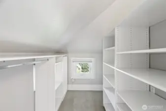 plumbing for washer/dryer behind shelves to the right