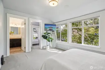 bright, south facing primary bedroom with walk-in closet and attached three-quarter bathroom