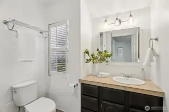 three-quarter bath attached to primary bedroom (shower behind)