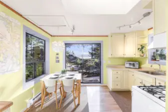 The open kitchen and dining room area has great windows that bring the outside in.