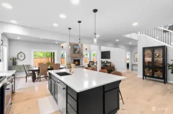 Open floor plan with high ceilings and roomy kitchen