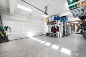 3 car garage with epoxy flooring and incredible storage