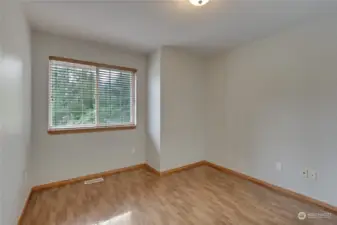 First spare bedroom on the second floor that is very spacious and gas stunning hard wood floors.