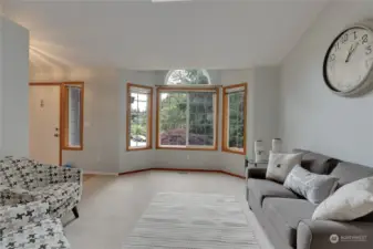 Giant bay windows in the living space, bringing in bright natural light
