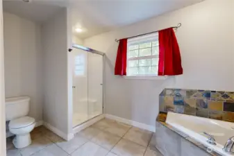 Primary Bathroom with shower and jetted tub