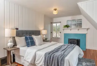Upstairs primary BR with Fireplace.