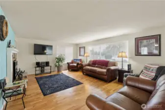Formal Living room includes fireplace, Room dimensions 14 feet by 19 feet.