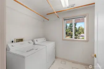 Laundry room on upper floor with bedrooms