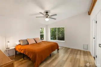 Spacious primary with new windows, flooring, walk-in closet and bath with soaking tub.