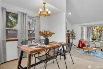 Bright windows leading out to the side yard and sightlines into the living room.