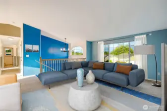 Step inside to a vaulted living room flooded with natural light, highlighting the airy, open-concept layout.  [Photo is virtually staged]