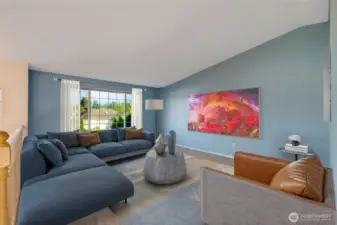 The high ceilings create a sense of spaciousness, perfect for family gatherings or quiet evenings at home.