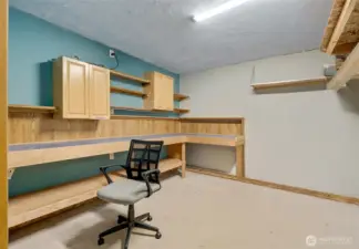 The garage includes a bonus room that could easily serve as a workshop, hobby space, or home gym.