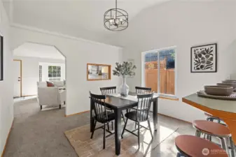 Dining room with large window and new light fixture!  Ready for the holidays