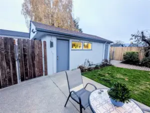 View from the back door.  The dog run is located nest to the fence, on the side of the garage.