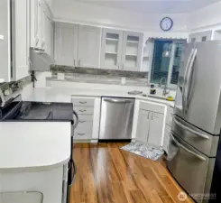 Granite countertops, soft-pull upper cabinets, new appliances.