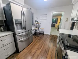 Another view of the kitchen - dining and living room in the distance.