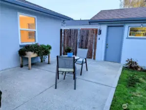 Patio leads to driveway and garage.