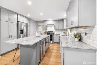 Island with Sharp microwave and bar fridge.