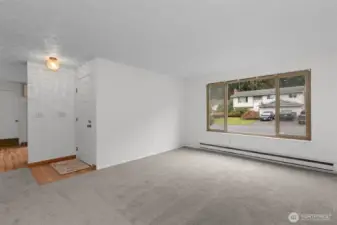 The home has all new carpet throughout, the Entryway, Kitchen, and Eating Nook have laminate plank flooring, and the bathrooms have ceramic tile.  Large east-facing Living Room window draws in all the morning light!