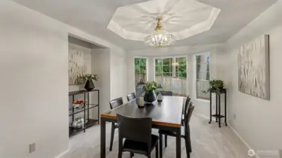 The dining room has a serving niche, a bay window and ceiling feature.