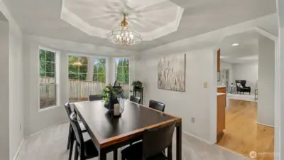 The dining room is just a step to the kitchen.  The bay window has excellent privacy and South facing natural light.