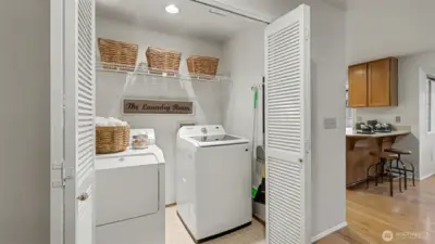 The well placed laundry closet  and washer and dryer remain with the home.
