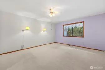 Primary bedroom looks out to nature and greenspace.