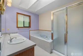 Primary ensuite with separate soaking tub and shower. Double sinks.
