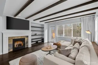 Cozy living room with wood burning fireplace.