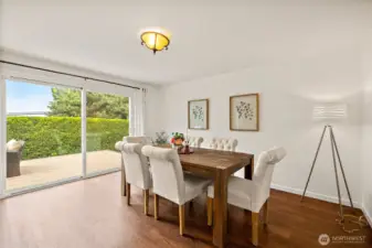 Formal dining room with slider to large deck.