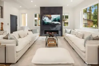 Spacious and inviting family room surrounded by walls of windows for a sunlit interior