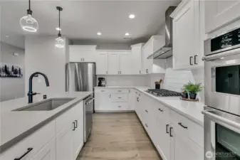 Custom door pulls throughout kitchen and bathrooms.