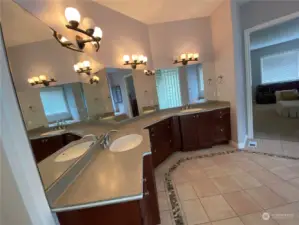 Master Bathroom with Natural Corian Counter top and designer's flooring tiles