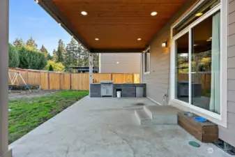 Covered patio with recessed lighting and outdoor kitchen with Blackstone grill!